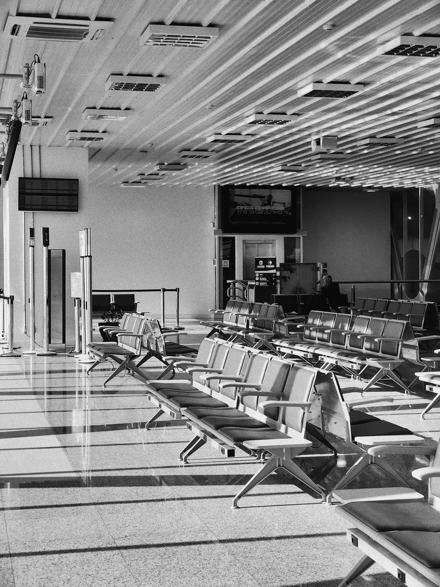 Empty airport departure seating in a quiet terminal