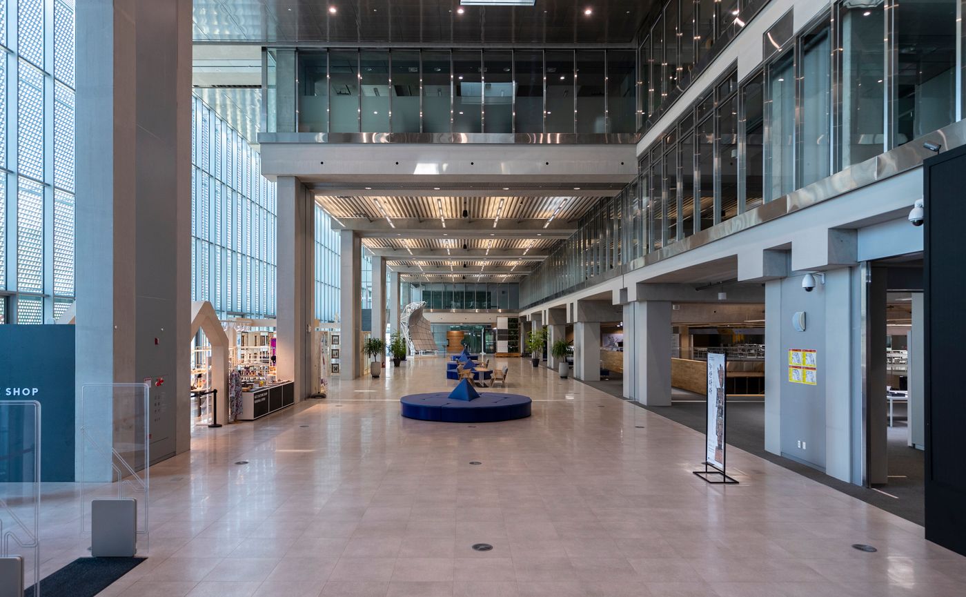 Airport terminal corridor with shops past security