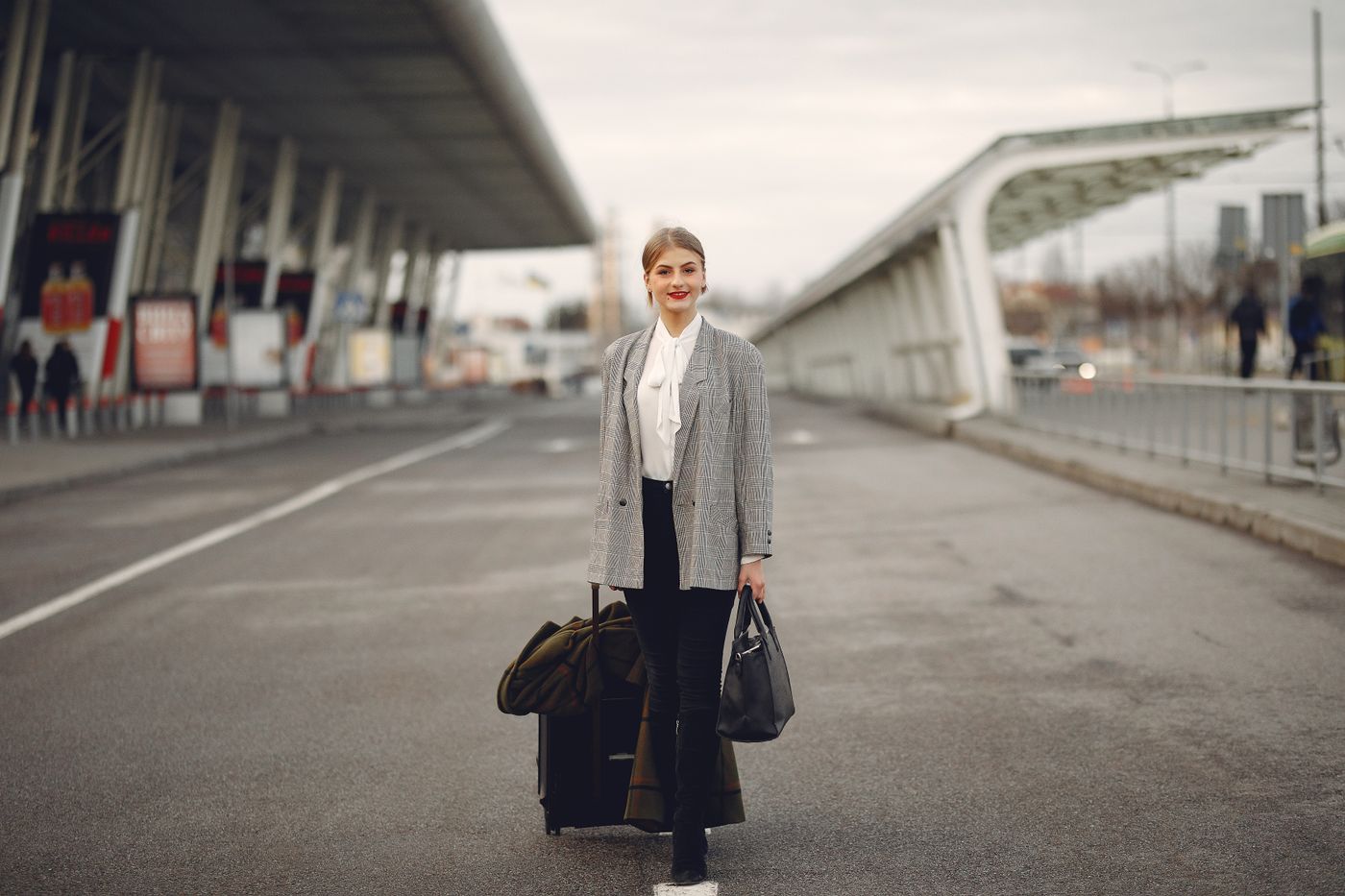 Traveller walking with luggage before a trip