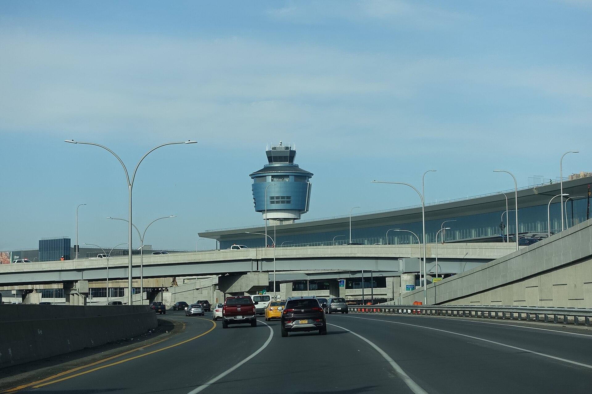 Traveling west on the Grand Central Parkway through LaGuardia Airport in East Elmhurst, Queens. Pictured is the air traffic control tower next to Terminal B (Central Terminal).